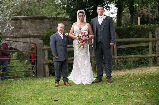 bride and groom with family